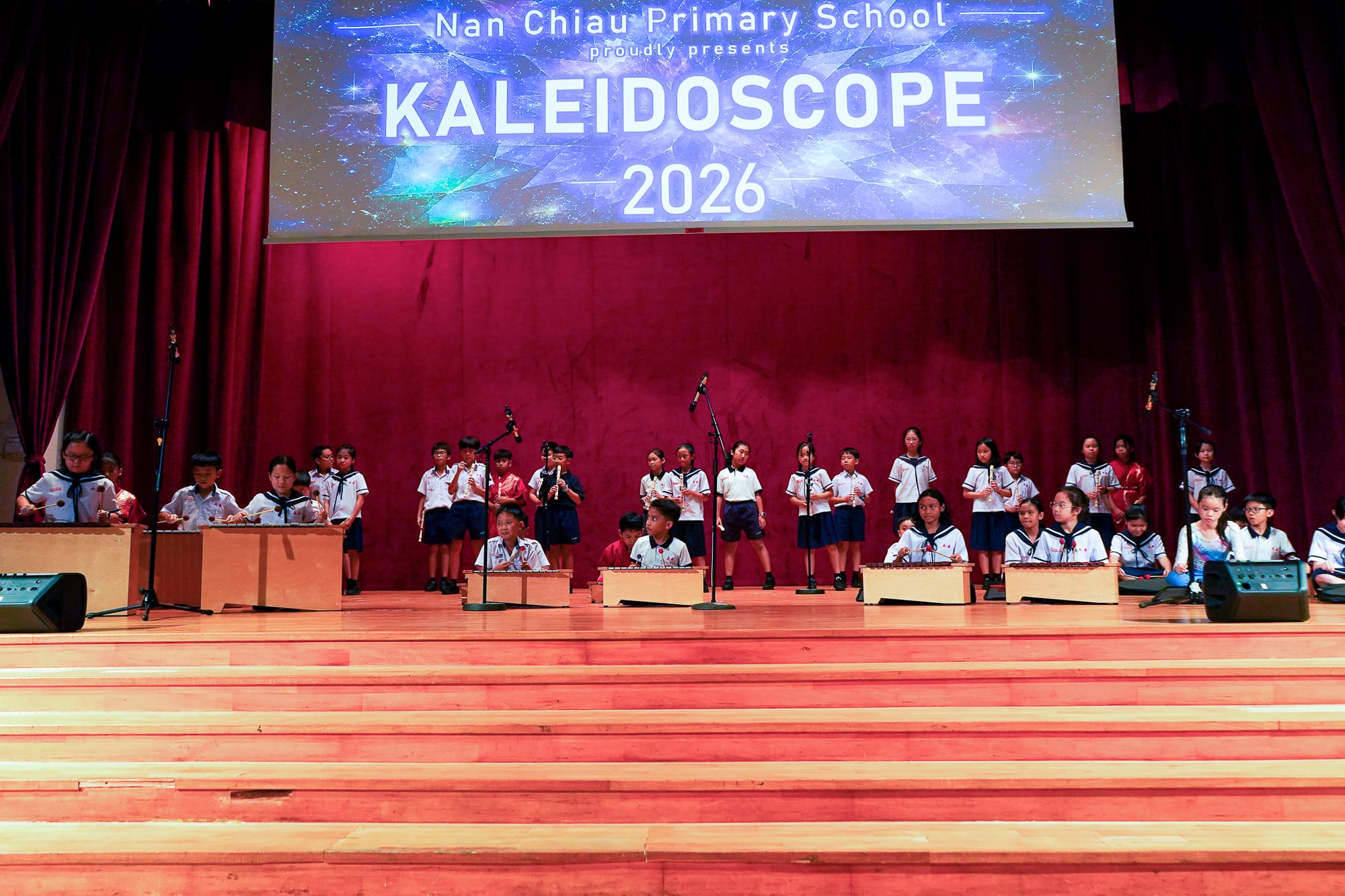 students performing on stage